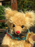 Pepi, 18cm small Robin Rive clown bear, red nose, sparkly green ruffle